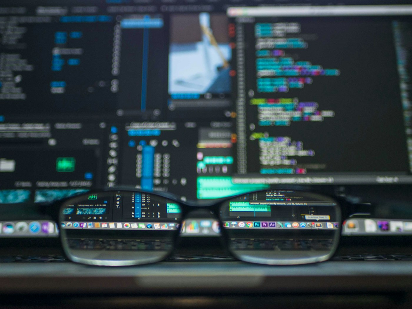 Code on screens seen through a pair of eyeglasses