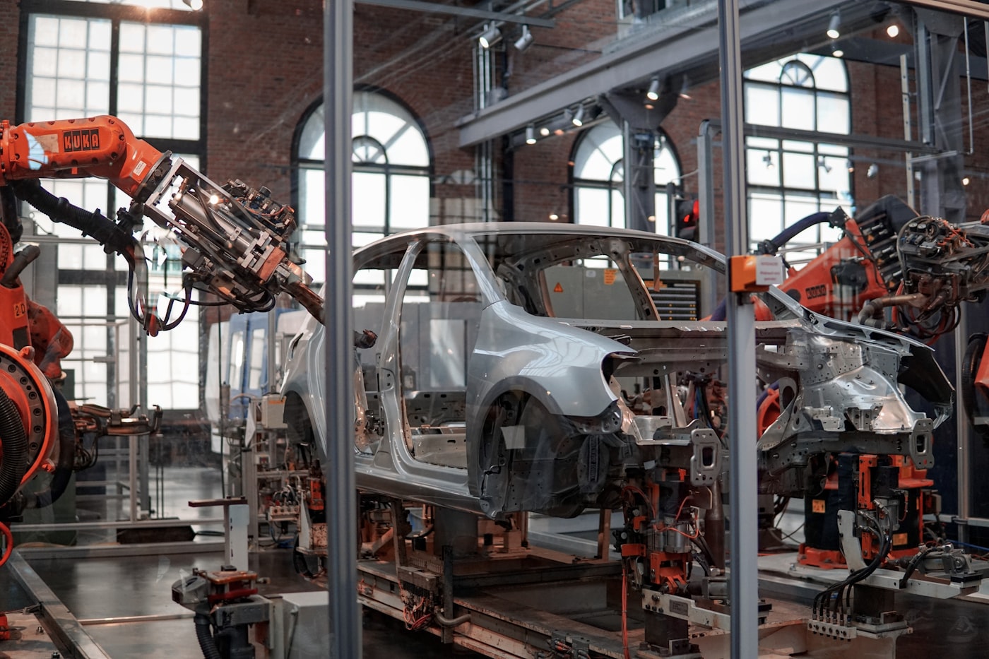 Robotic arms assembling a car body on an automated production line
