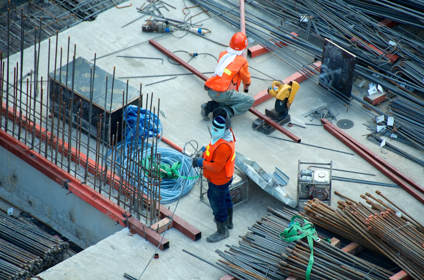 Construction workers placing rebar